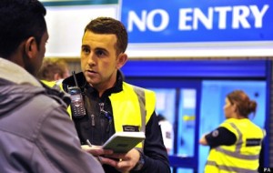 UK Border Agency officials question people during a raid at Bestway Cash and Carry in Liverpool.