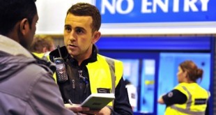 UK Border Agency officials question people during a raid at Bestway Cash and Carry in Liverpool.